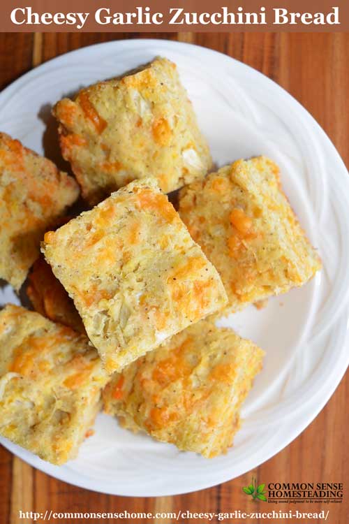 Cheesy garlic zucchini bread is a savory quick bread made with zucchini or summer squash teamed up with cheddar cheese and garlic.