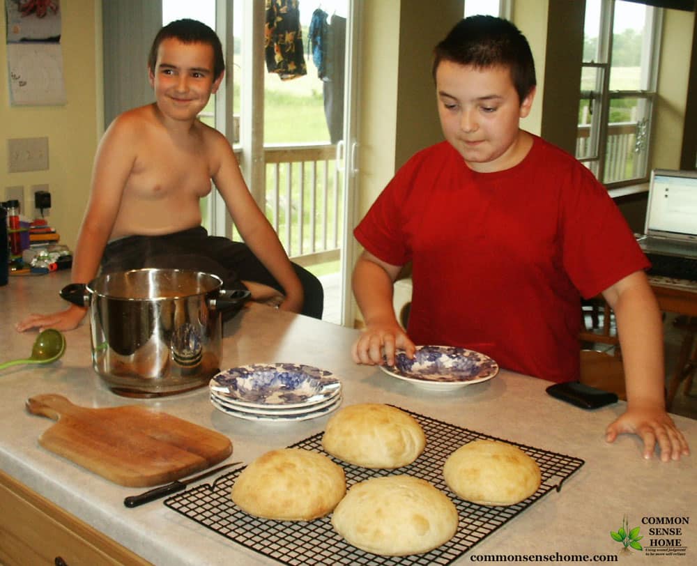 boys hungry for cheese soup in bread bowls