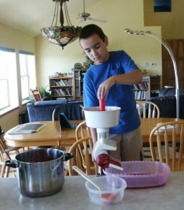 straining raspberries