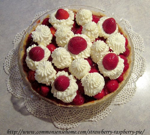 Strawberry-Raspberry Pie - a sugar cookie crust filled with fresh strawberries in a strawberry-raspberry puree, and topped with sweetened whipped cream.