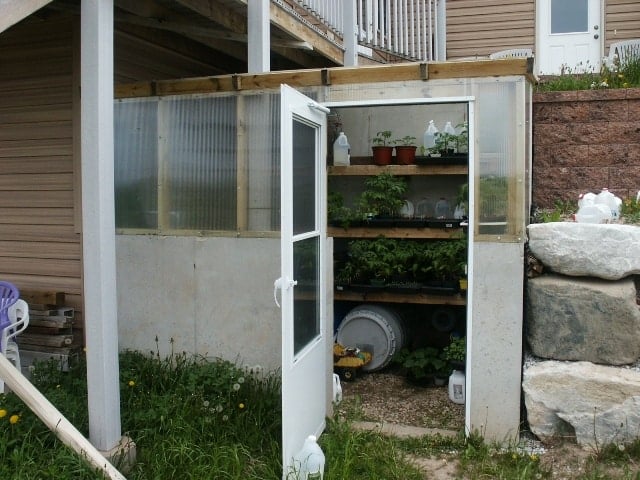 earth sheltered greenhouse attached to southeast corner of home