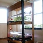 Learn how to build your own simple seed starting shelves with grow lights and room for up to 576 seedlings. Sturdy, moveable and easy enough for a weekend project.