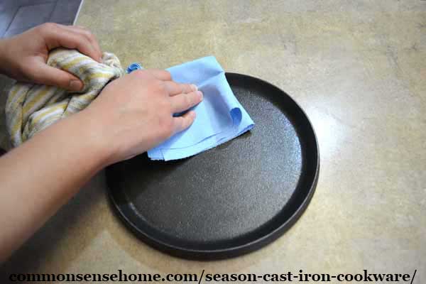 wiping off excess cast iron seasoning oil