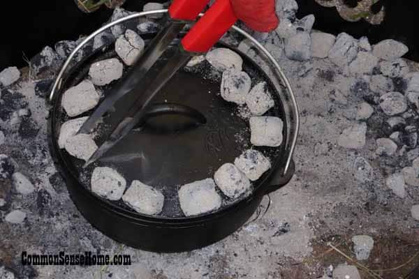 Dutch oven with coals on lid