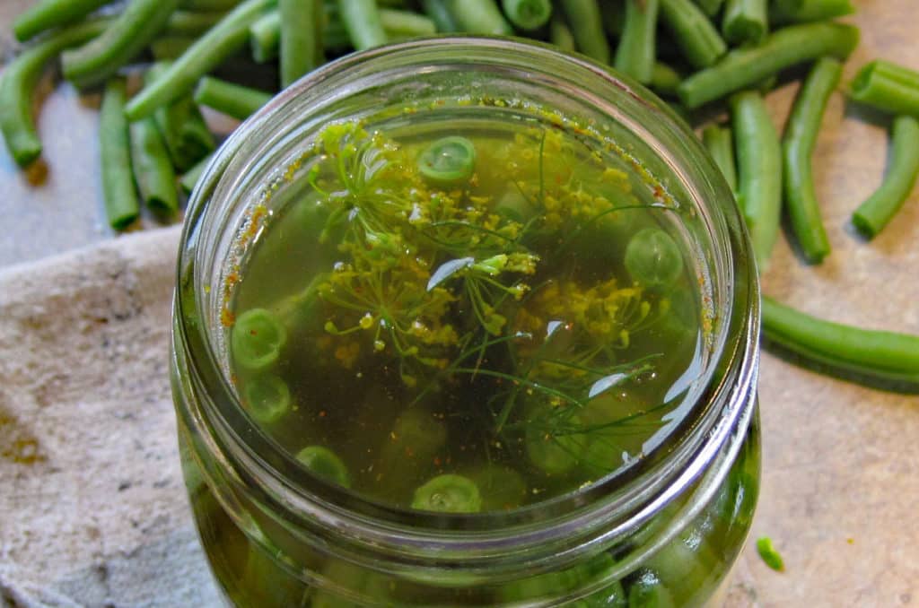 close up of top of beans in jar