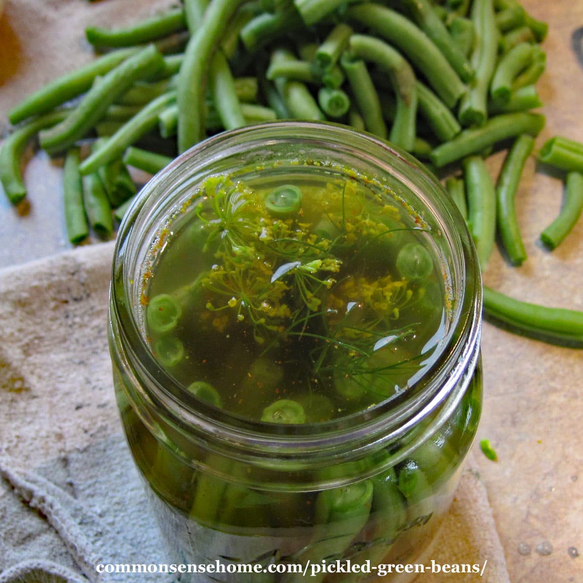 close up of top of beans in jar