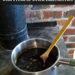 elderberry syrup cooking on top of wood stove