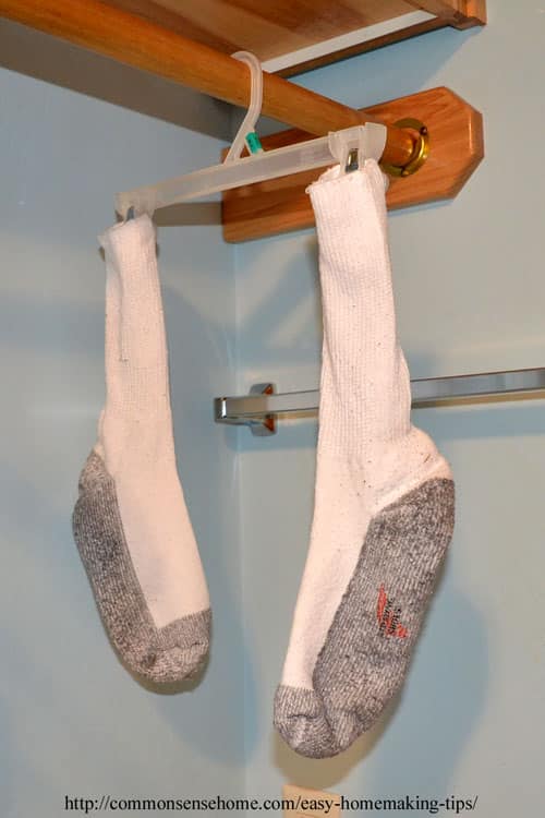 Socks drying on plastic hanger