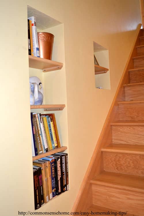 Shelves in wall alongside stairs