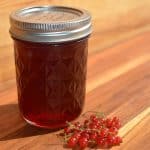 jar of currant jelly and currants