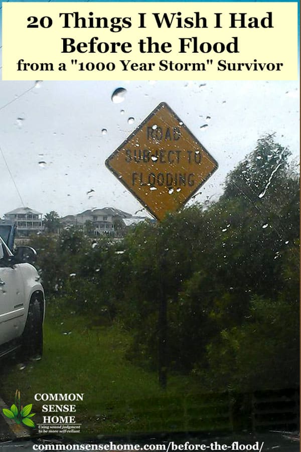 "road subject to flooding" sign in rainstorm