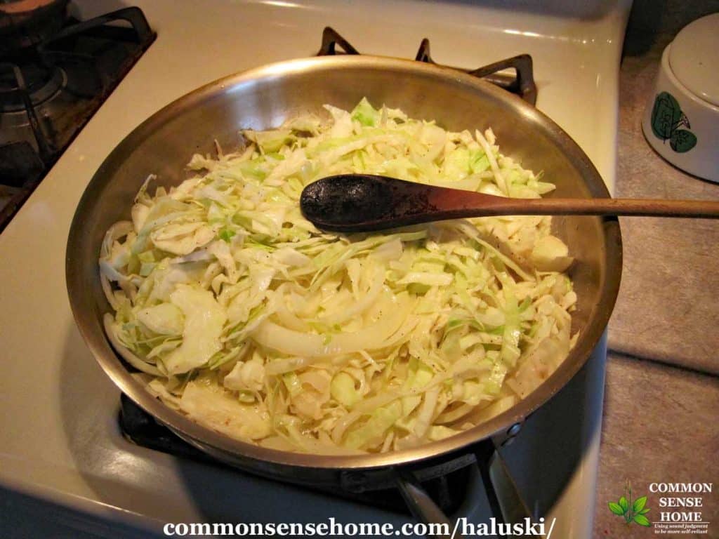 cabbage and onions in pan for haluski