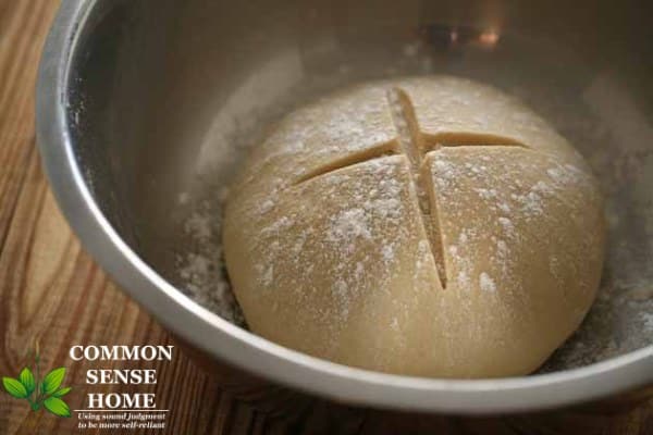 scored challah dough