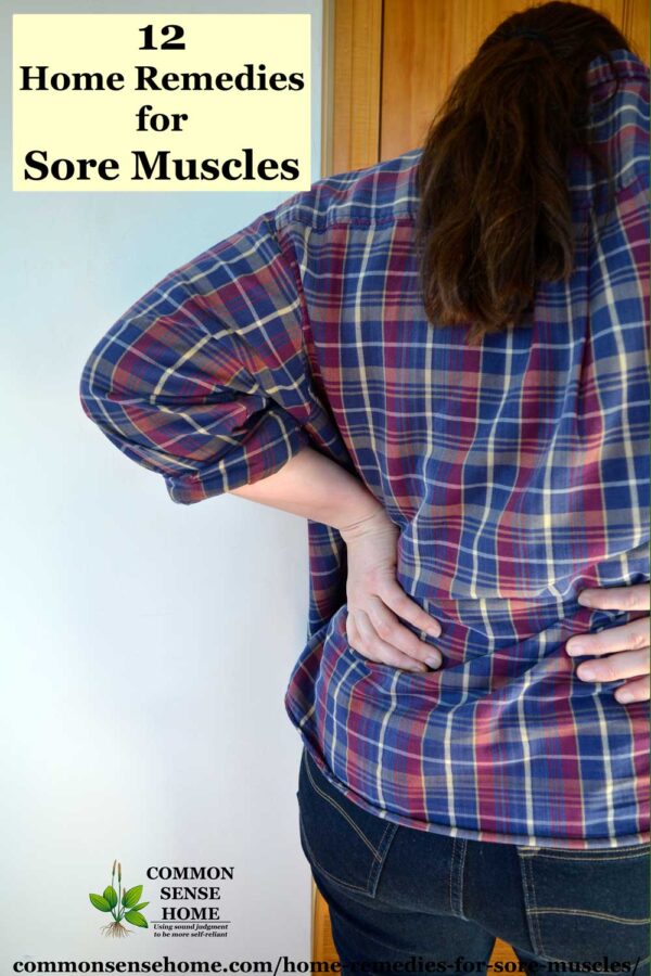 sore muscles in back of woman wearing flannel shirt