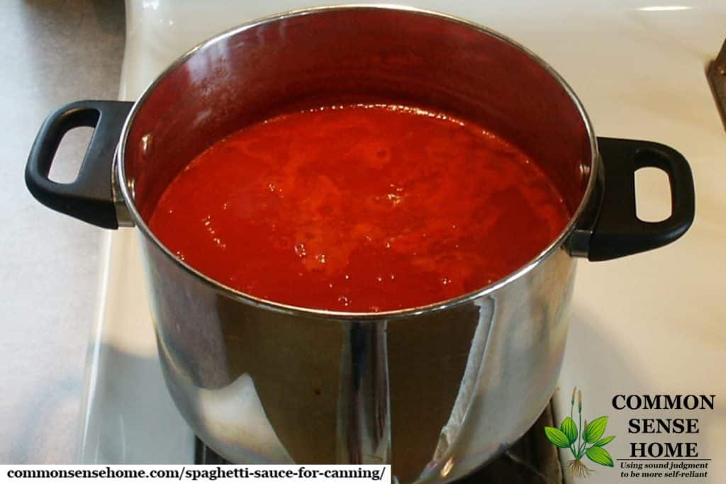 stock pot filled with tomato sauce cooking down