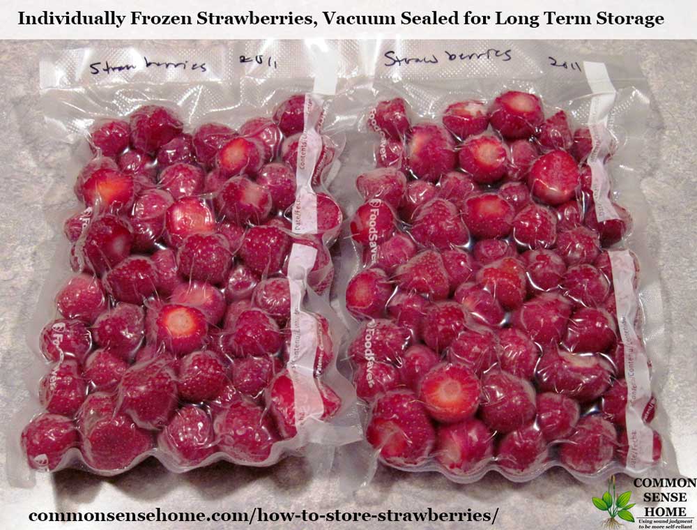 two packages of vacuum sealed frozen strawberries