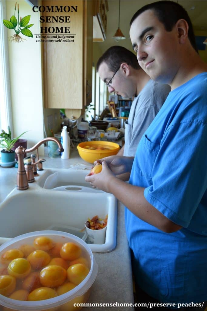August and Duncan peeling peaches (2016)