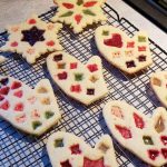 Christmas sugar cookies decorated to look like stained glass