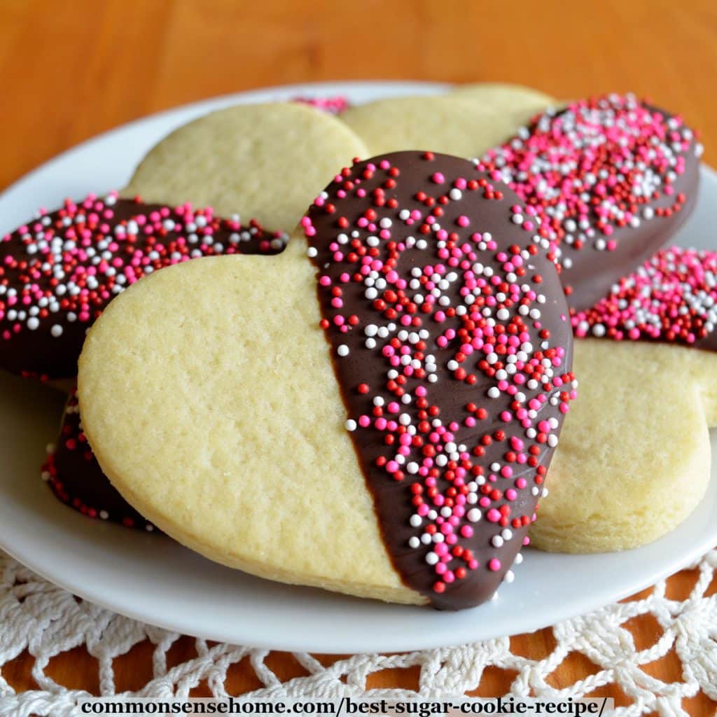 best sugar cookie cut into heart shape and dipped in chocolate with sprinkles