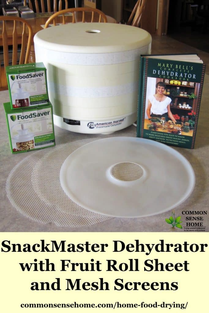Snackmaster dehydrator on a table with accesories next to it