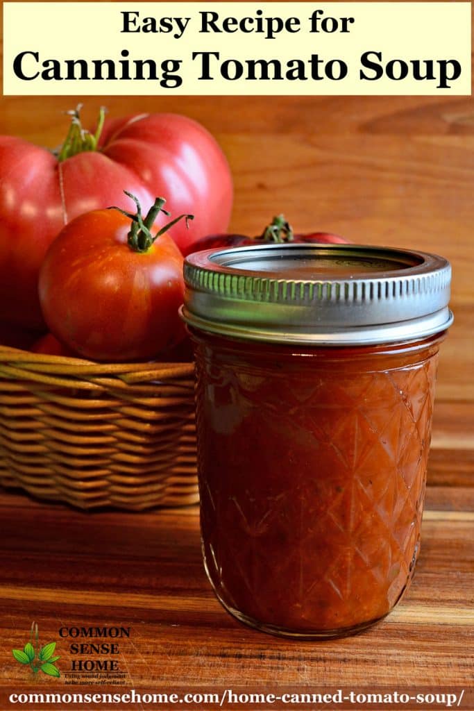 home canned tomato soup in mason jar with tomatoes in basket