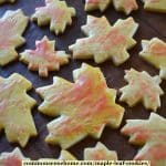 maple leaf cookies with orange and yellow maple syrup glaze