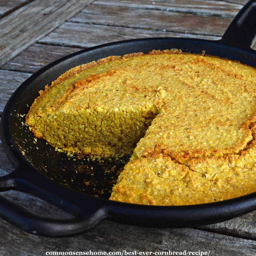 cornbread in cast iron skillet on wooden table