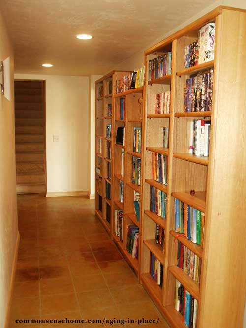 Bookshelves in the hallway allow for extra storage space.