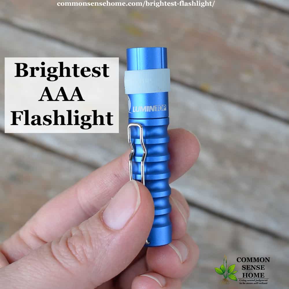 brightest AAA flashlight - small blue flashlight sitting on wooden table