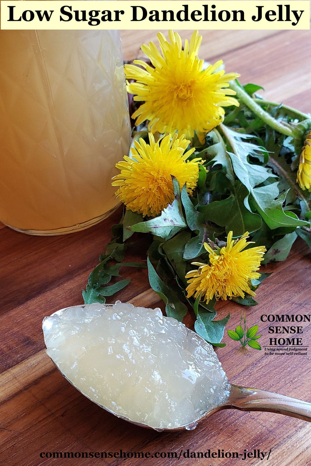 spoonful of low sugar dandelion jelly on cutting board with dandelions and jar of dandelion jelly