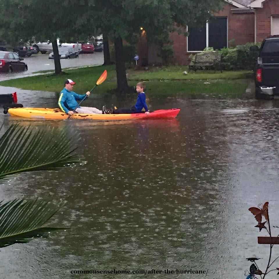 canoe in floodwaters after Hurricane Harvey