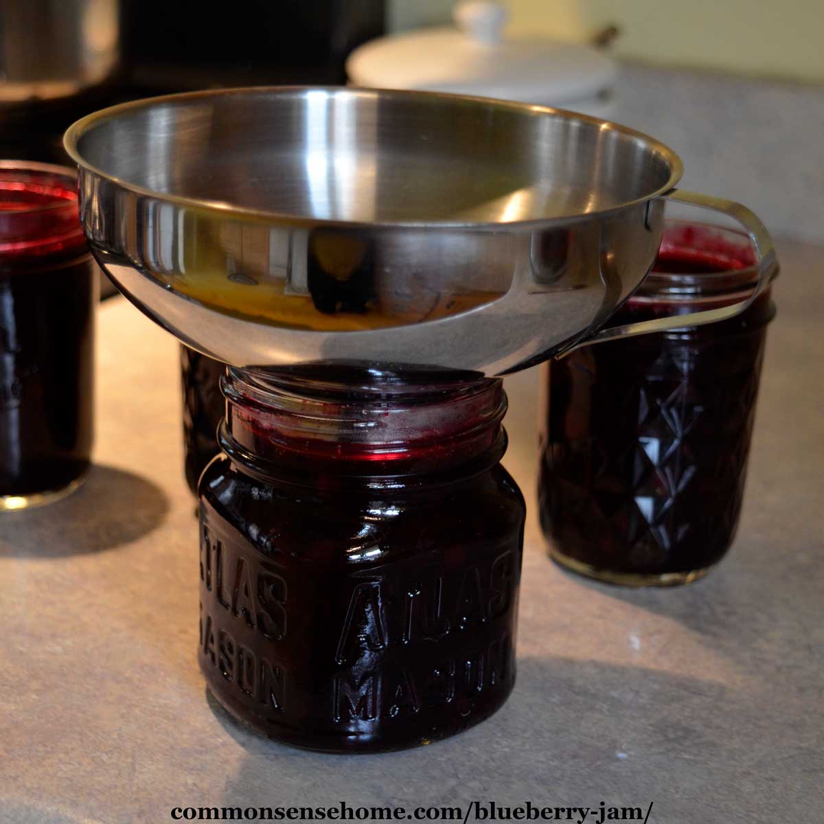 filling jars with homemade jam