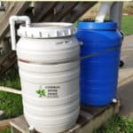 two 50 gallon drum rain barrels
