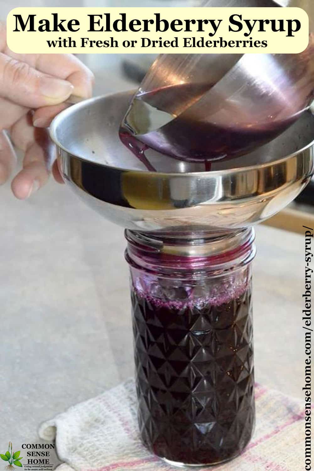 filling mason jar with homemade elderberry syrup