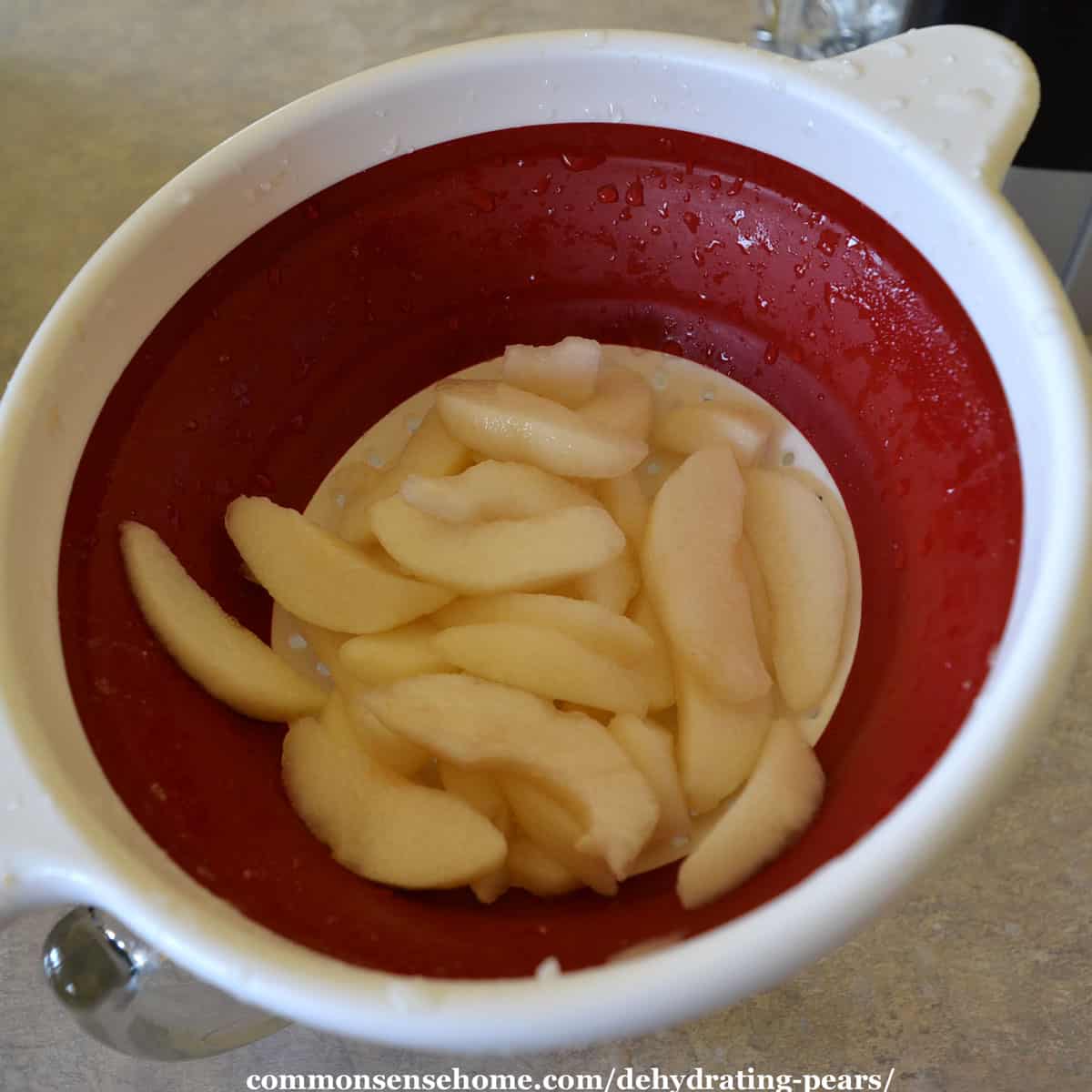 draining pears in a colander