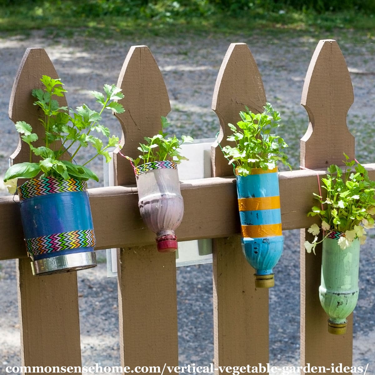 hanging herb planters on fence