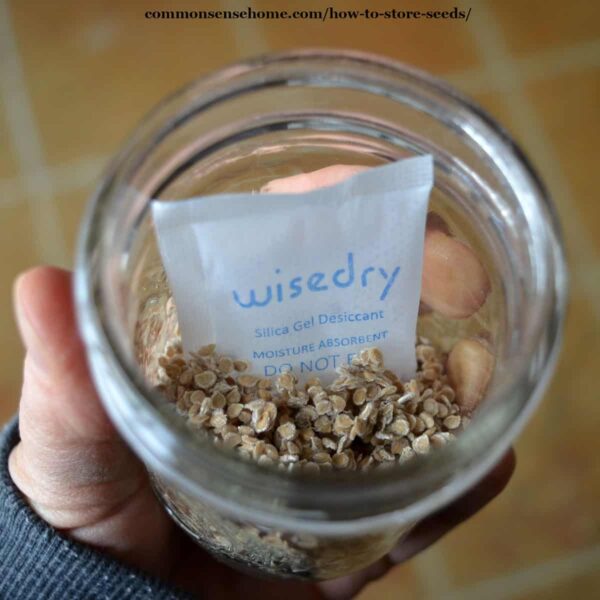 tomato seeds in glass jar with moisture absorber