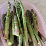 pink bin filled with assorted asparagus spears