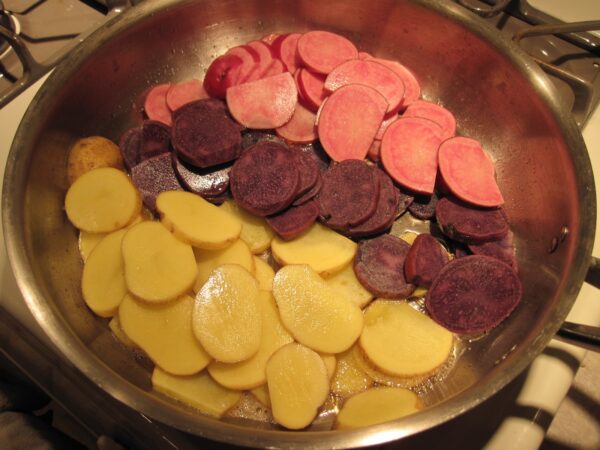 red white and blue potato slices in a pan