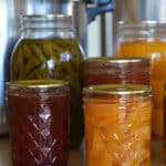 text at top "canning headspace - guidelines and chart" with jars filled with home canned foods
