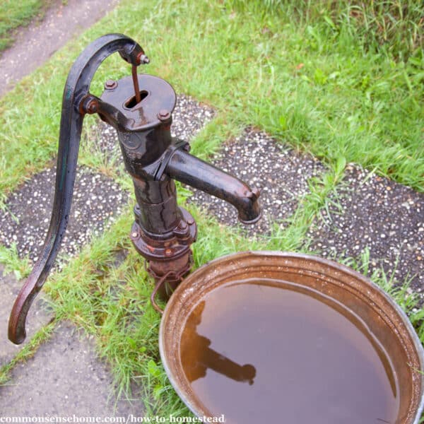 old hand pump with water basin