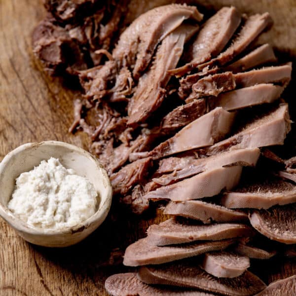 Sliced cow tongue with horseradish