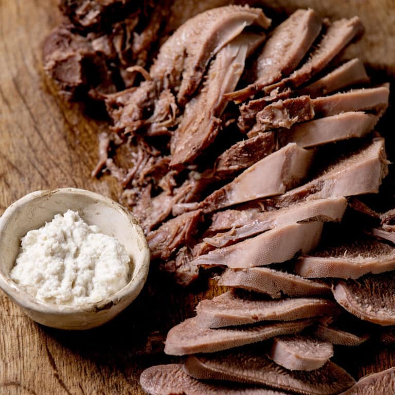 Sliced cow tongue with horseradish