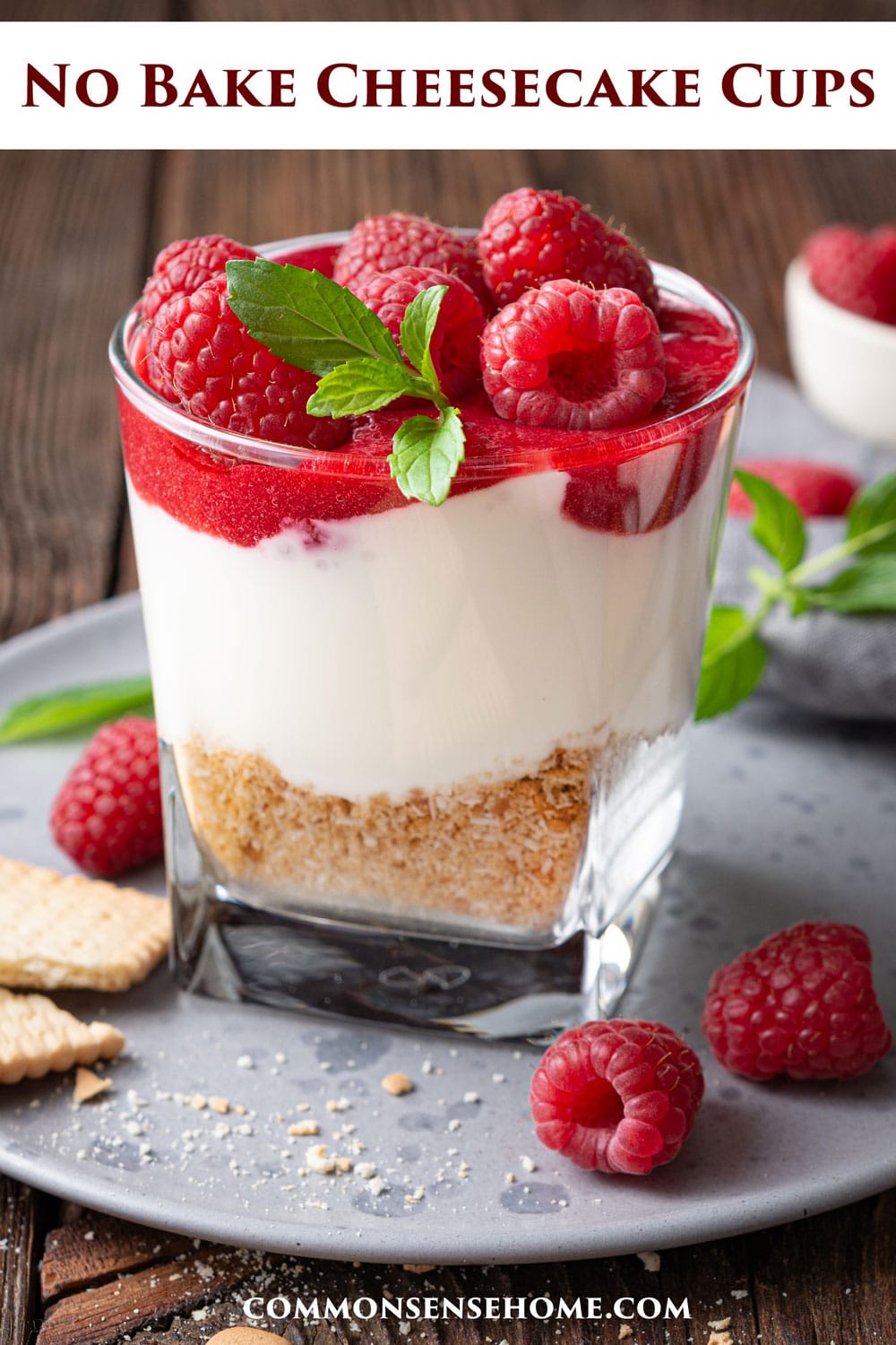 no bake cheesecake cup with raspberry puree and fresh berries