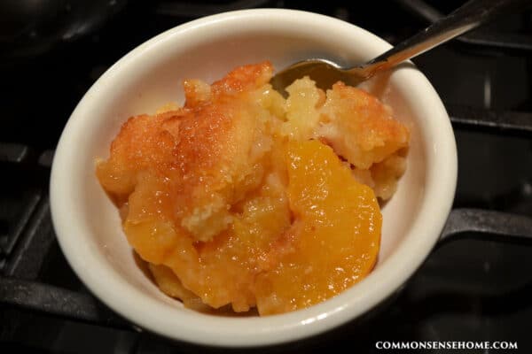 serving of peach cobbler made with canned peaches