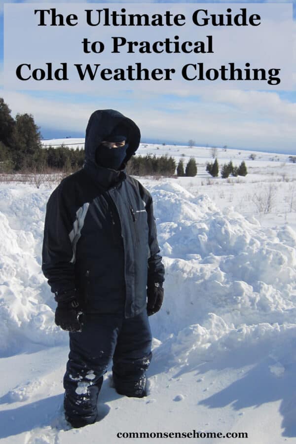 young man in cold weather gear standing in snow