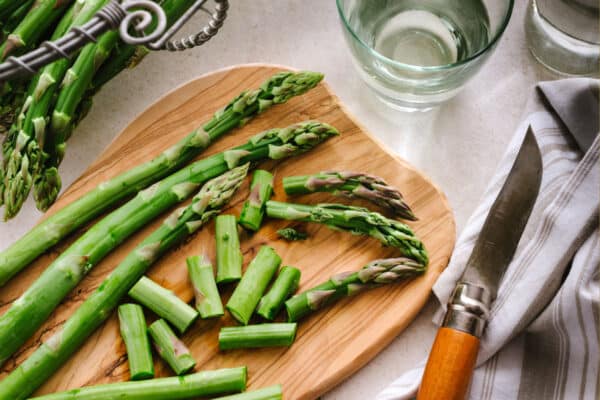 cut asparagus on cutting board