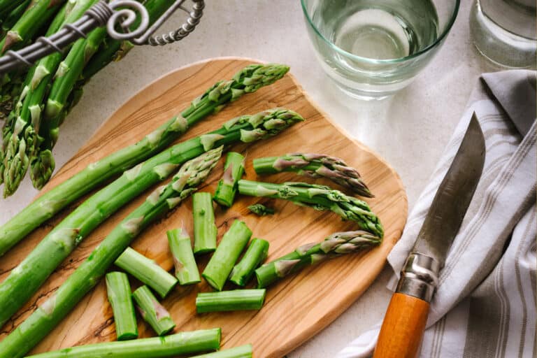 cut asparagus on cutting board