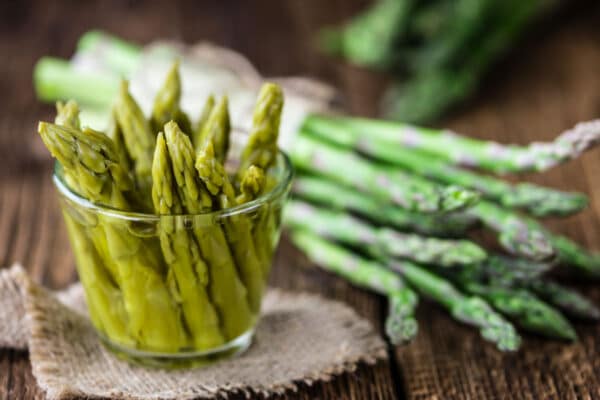 pickled asparagus in glass dish