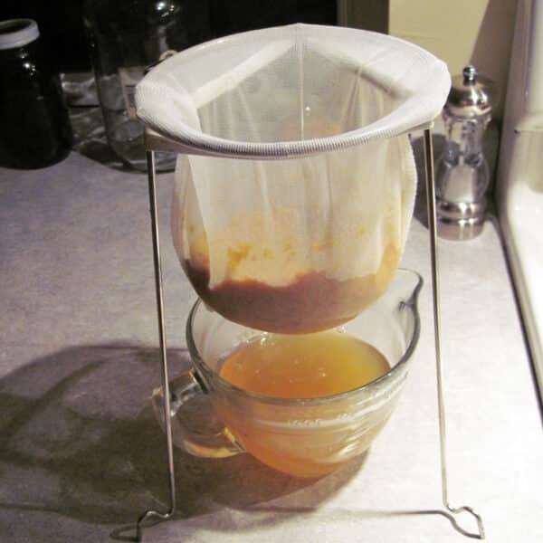 draining juice form cooked fruit